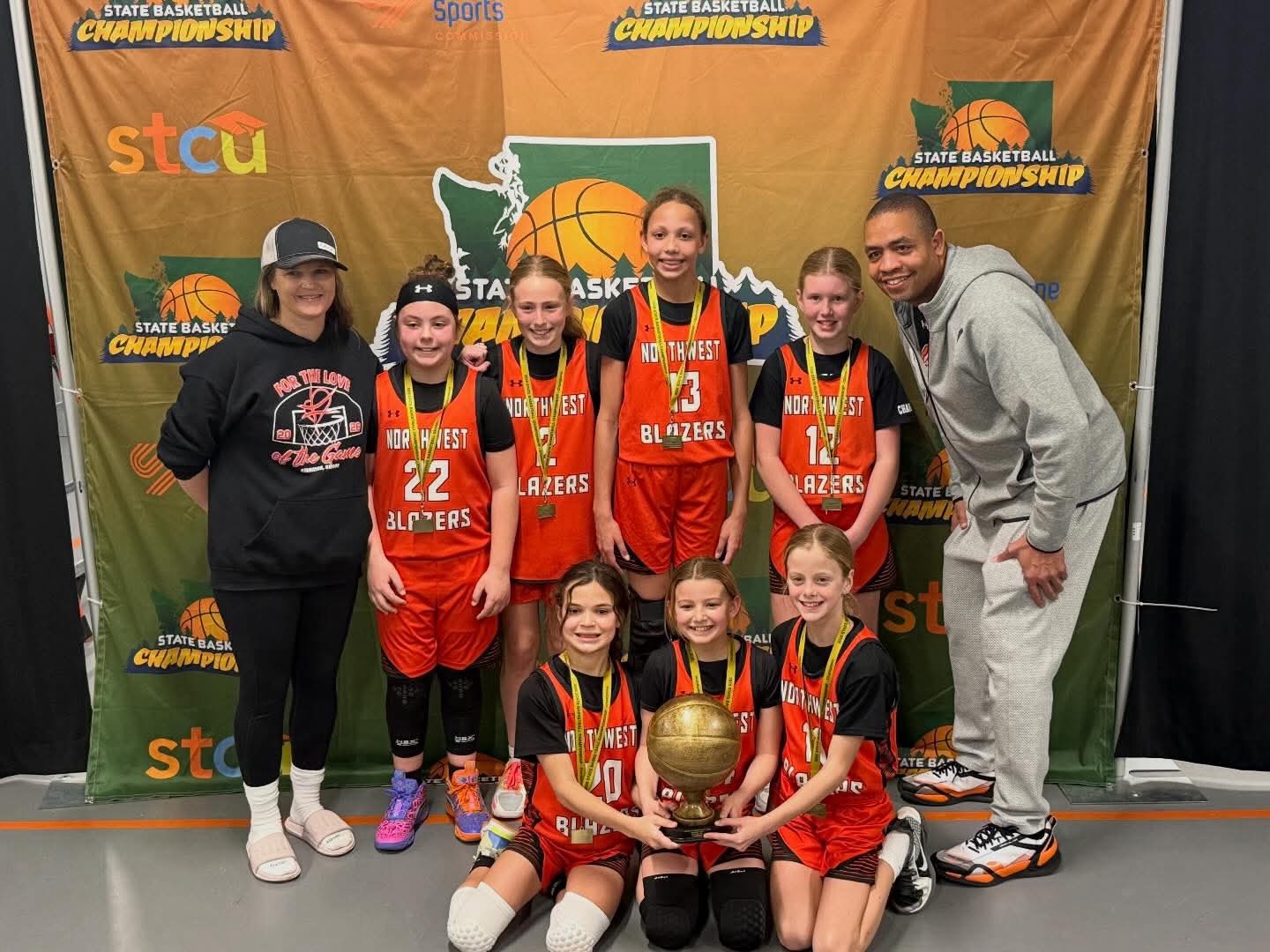 Northwest Blazers 4th grade girls team celebrating a Washington State championship.